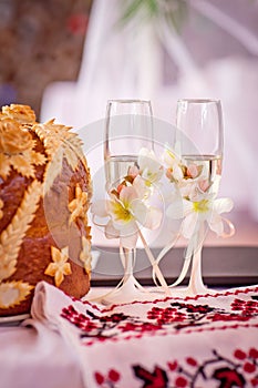 Two wedding glasses with champagne