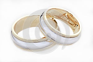 Two wedding golden rings isolated on white