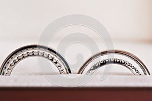 Two wedding rings in infinity sign. Love concept. the wedding of two sisters twins