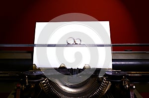 Two wedding rings in infinity sign on a typewriter. Wedding vow concept