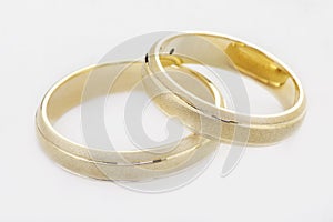 Two wedding rings isolated on white