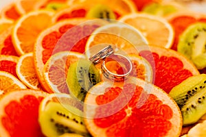 Two wedding rings on oranges marriage orange