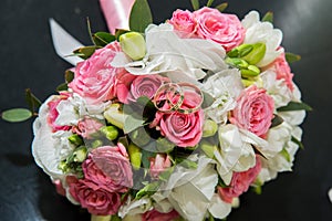 Two wedding rings, red roses