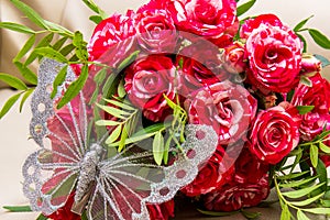 Two wedding rings, red roses. Arsenie butterfly.