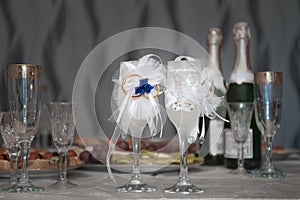 Two wedding wine glasses on banquet table