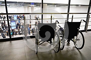 Two wheelchairs at the airport