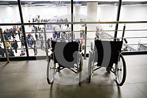 Two wheelchairs at the airport