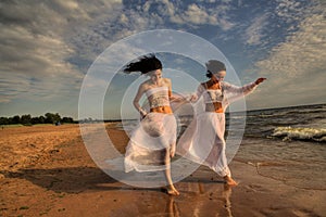 Two white angels on the beach