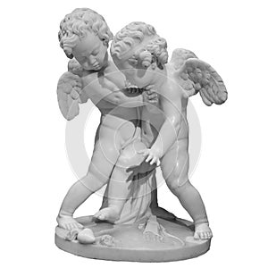 Two white angels figurines isolated on white background. Cupids sculpture. Stone statue of young cherubs