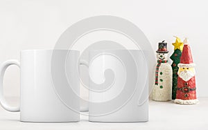 Two white blank coffee mugs Christmas theme mock up to add custom design or quote.