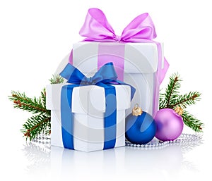 Two white boxs tied pink and blue ribbon bow, pine tree branch and christmas balls Isolated on white