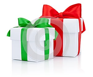 Two White boxs tied red and green ribbons bow Isolated on white