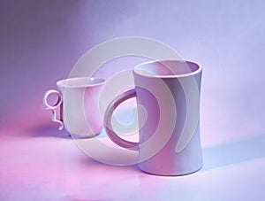 Two white ceramic mug in high-key. White background