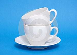 Two white coffee cup piled photo
