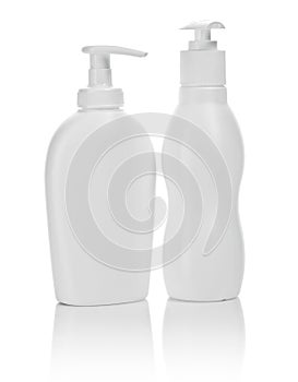 Two white cosmetical bottles isolated