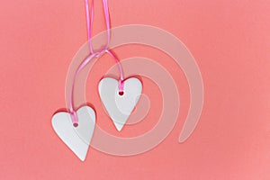 Two white coupled hearts background. Holiday concept for wedding or Valentines Day