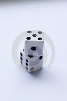 Two white dice with black dots on a white background.