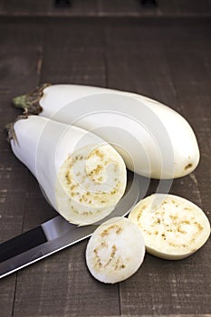 Two White Eggplants on a Cutting Board and Sliced