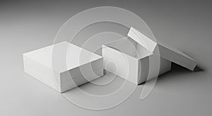 Two White Gift Boxes One Open One Closed on Gray Surface