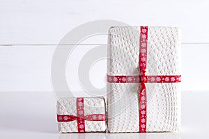 Two white gift boxes with polka dots