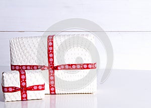 Two white gift boxes with polka dots