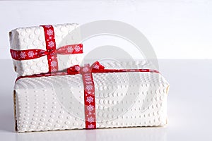 Two white gift boxes with polka dots