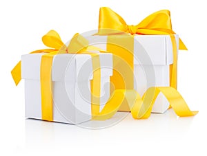 Two white gift boxes tied a yellow ribbon bow Isolated