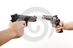 Two white hands hold gun