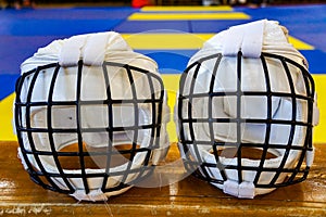 Two white karate hardhats