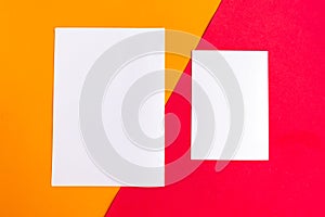 Two white mockup blanks on geometric orange and red background.