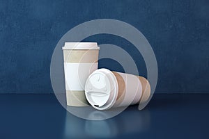 Two white paper coffee cups