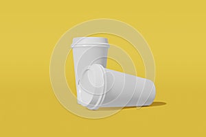 Two white paper mockup cups with a lid on a white background. One cup vertically, the second horizontally on its side. 3D