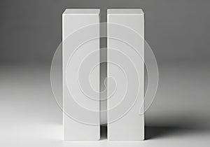 Two white rectangular blocks standing upright side by side on a flat surface