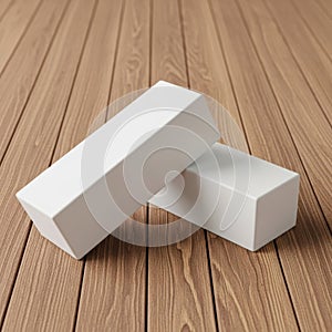 Two white rectangular blocks on a wooden surface