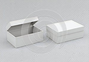 Two white rectangular boxes, one open and one closed, on a gray surface