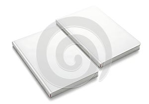 Two white rectangular objects on a plain background