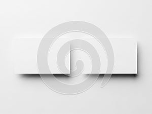 Two white rectangular objects with subtle shadows on a plain background