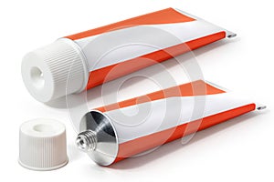 Two white with red tubes of ointment on a white background. Full depth of field.