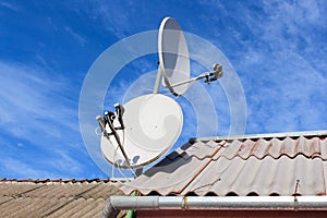 Two white satellite dish on the roof