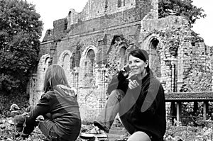 Two white tourists visiting ruins