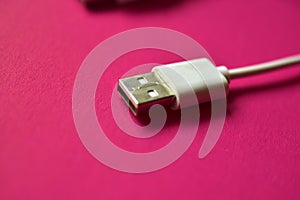 Two white USB connectors on a red background