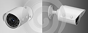 Two white wireless security surveillance camera on the wall