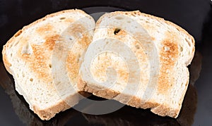Two whole grain slices of bread toasted
