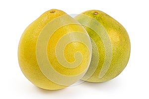Two whole ripe pomelo on a white background