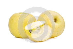 Two whole and slice of golden or yellow apple fruit isolated