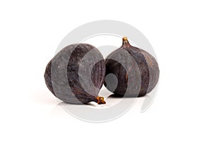 two whole sweet fig fruits isolated on white