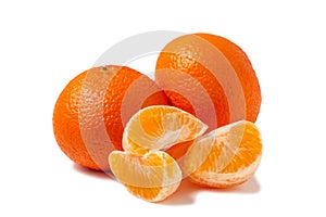 Two whole tangerine and peeled mandarin slices isolated on white background with shadow