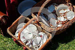 Two Baskets Full of Antique Teacups and Saucers.
