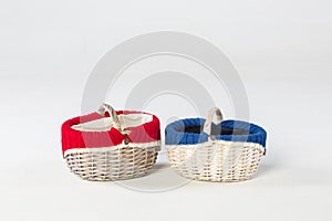 Two wicker baskets with knits inside in