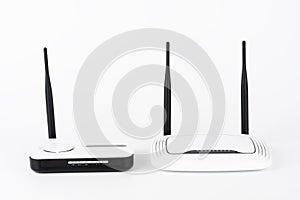 Two wifi routers, wireless devices with one and two antennas on white background